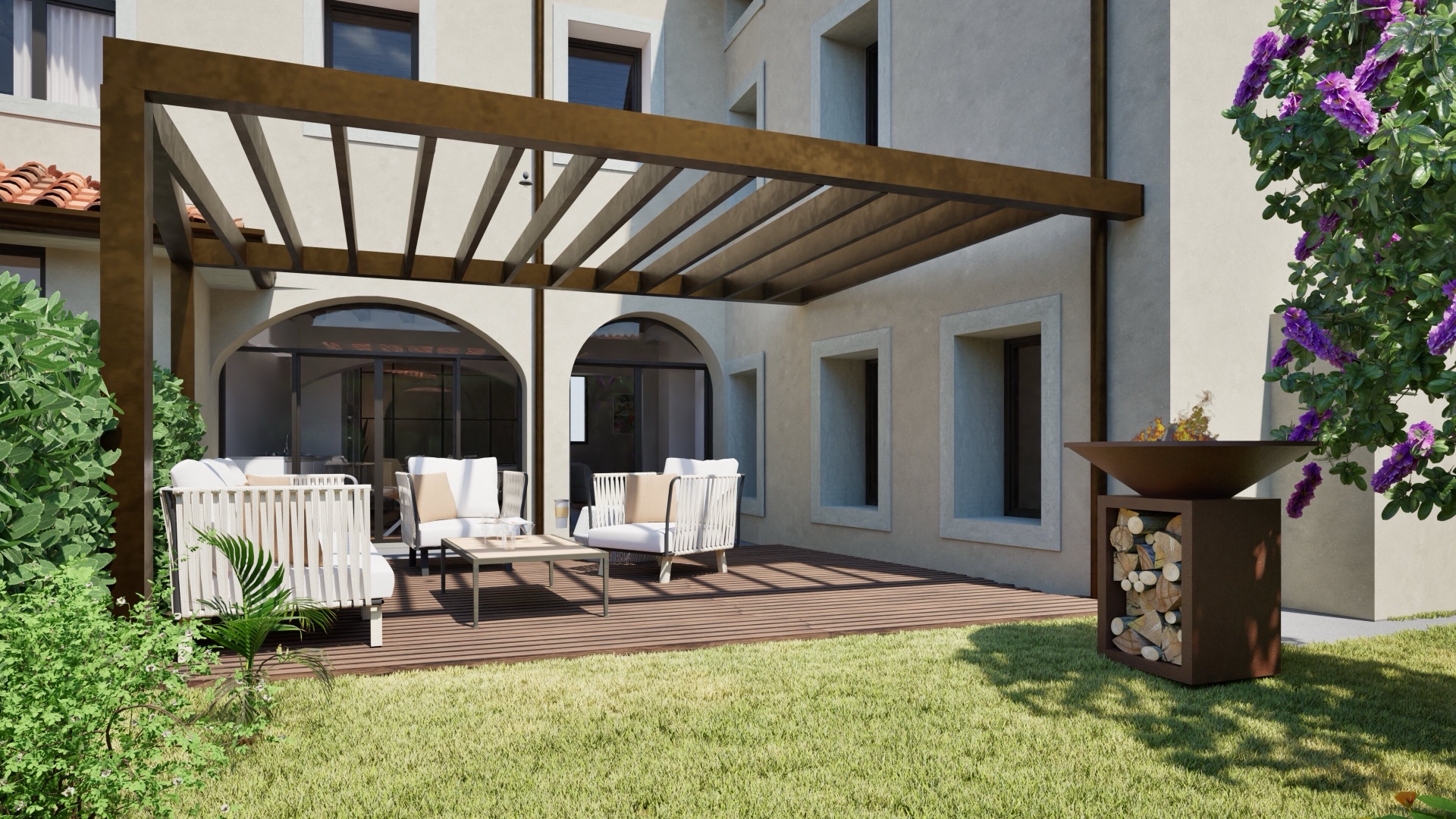 La corte interna con il portico, il giardino e la zona pranzo all’aperto